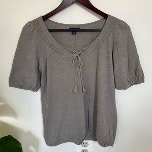 light top with embroidery detail around the neck and sleeves